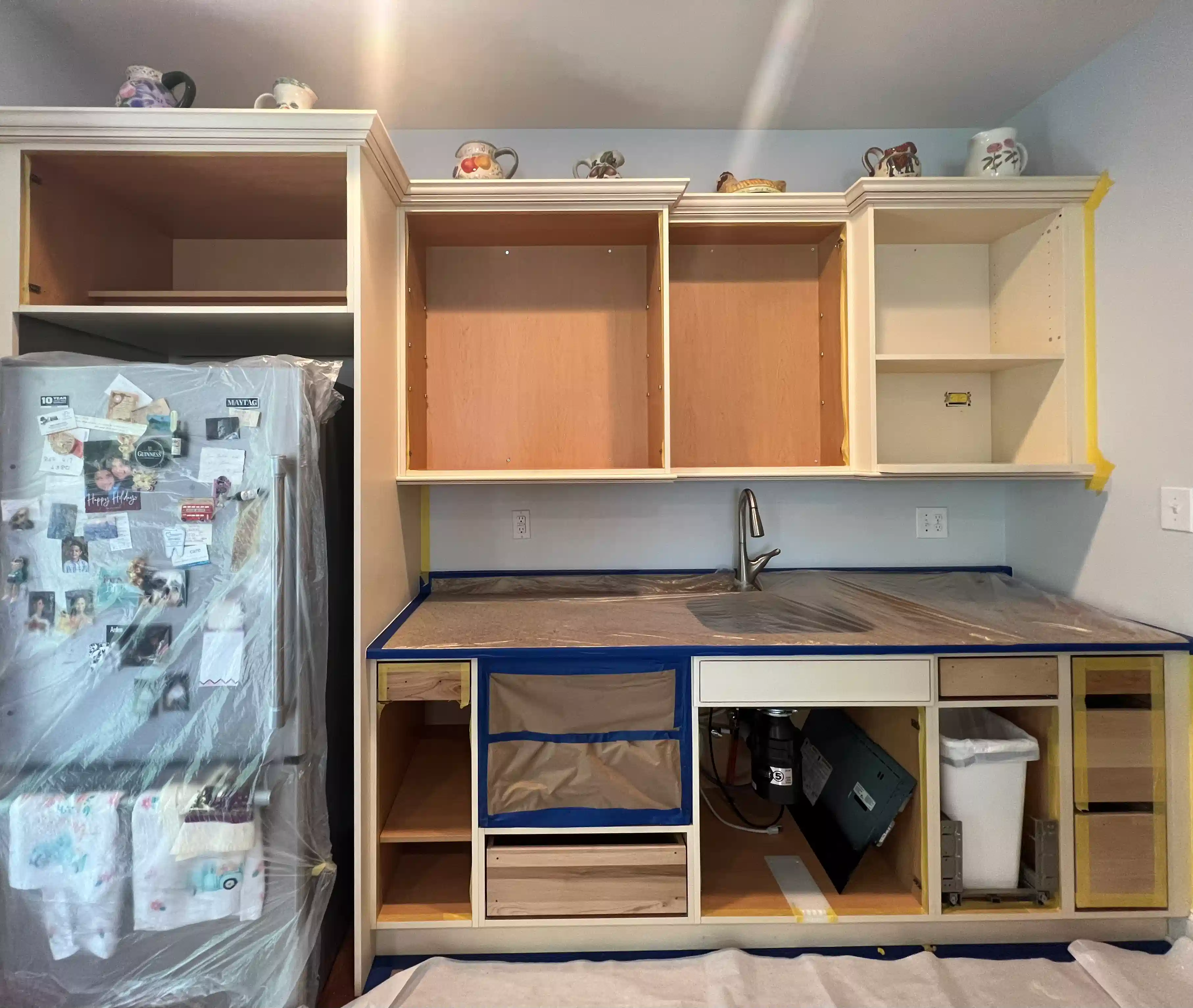 Before and after of a kitchen cabinet painting project