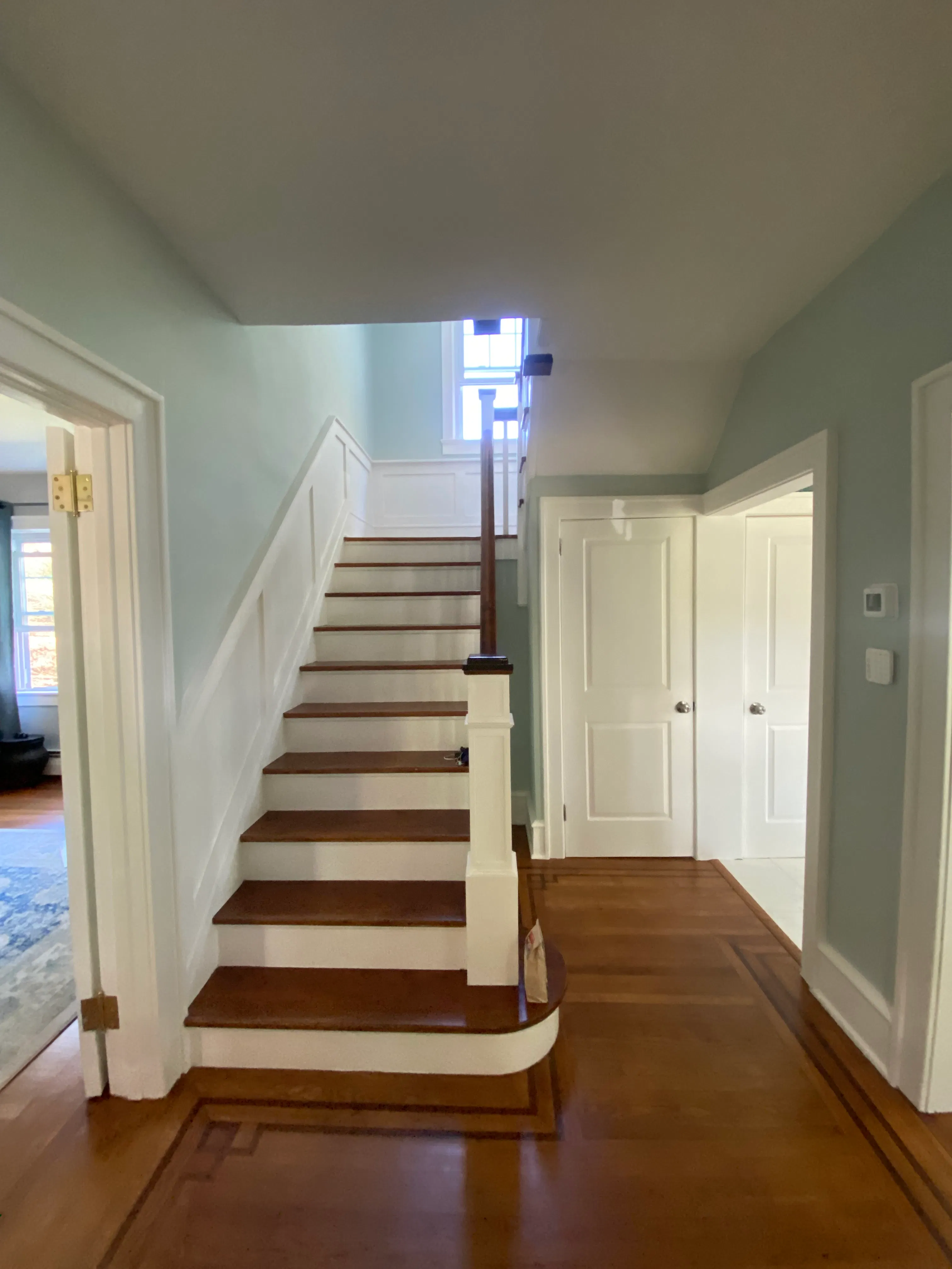 Crisp semi-gloss trim and matte walls in a Collingswood staircase project